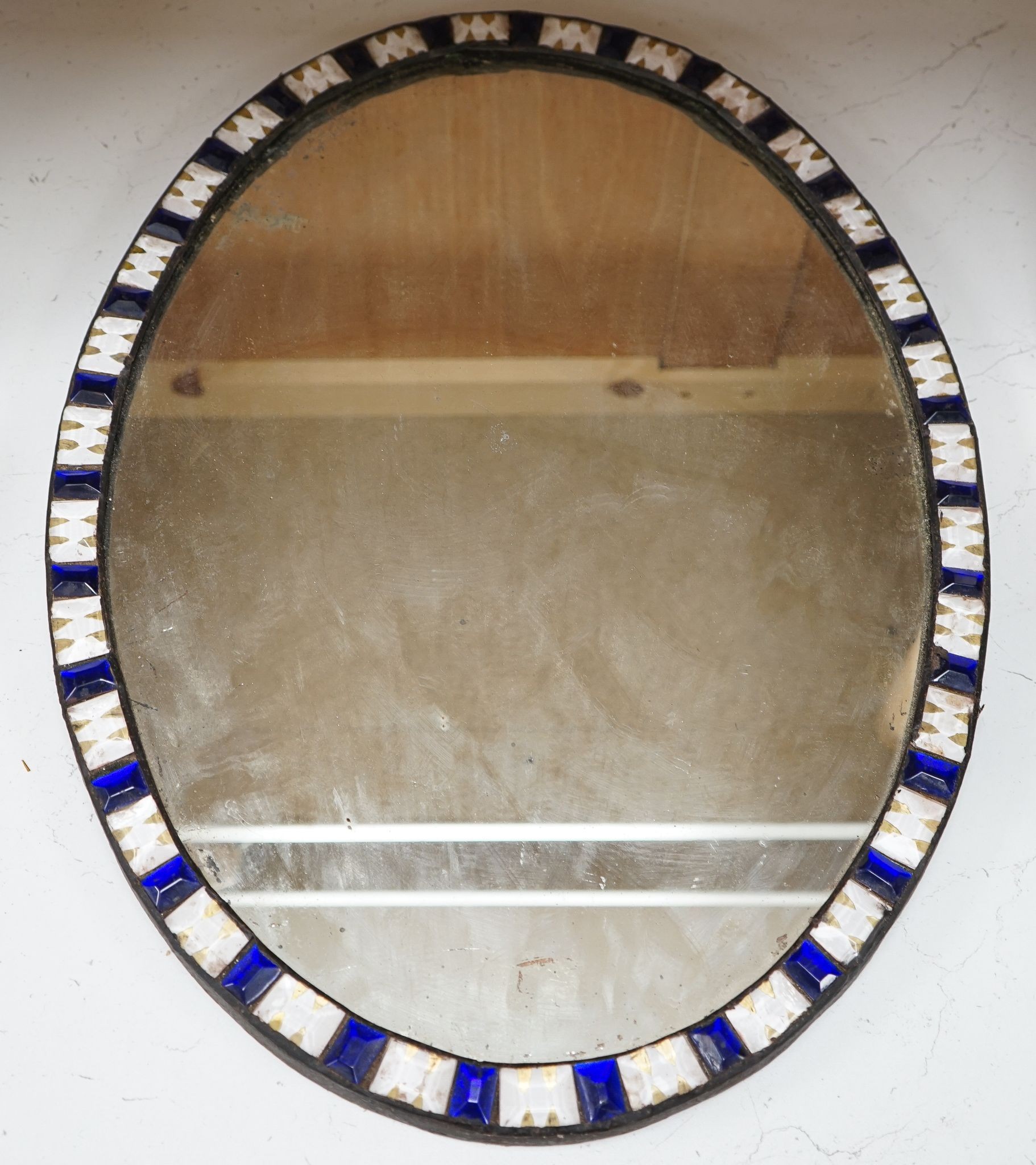 An oval Irish-style wall mirror, 56x41cm